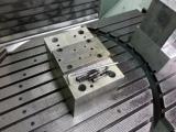 Holding fixture for 5-axis reboring of spindle housings.